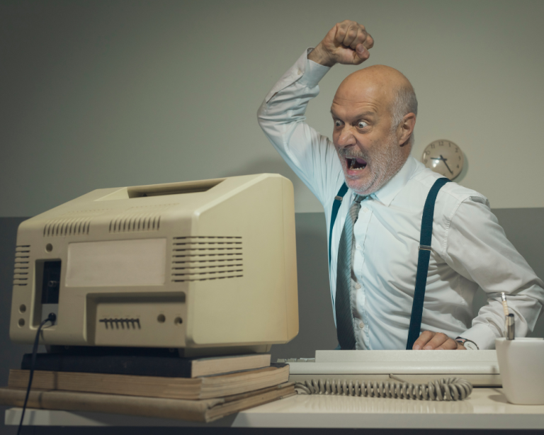 Man about to hit old computer